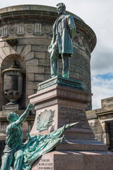 Edinburgh, Scotland, UK - June 13, 2012: Abraham Lincoln bronze statue with surrounding brown stone...