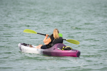 Woman on the Hagg lake kayaking.
