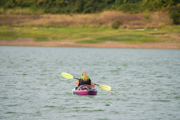 Woman on the Hagg lake kayaking.