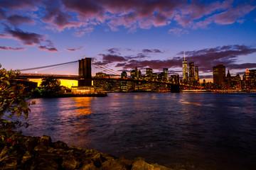 Fototapeta na wymiar New York Skyline with Brooklyn Bridge Hudson River Manhatten Twi