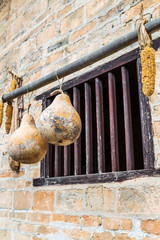 Gourd and corn hanging from farmers' windows
