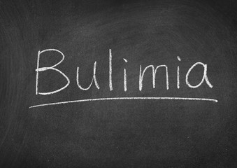 Obraz premium Bulimia concept word on a blackboard background