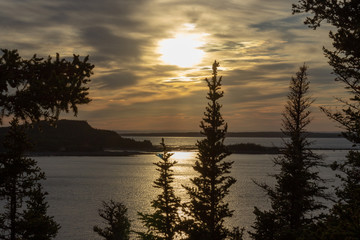 Fototapeta na wymiar Dramatic sunset over the Baie des Ha! Ha! (Rimouski, Quebec, Can