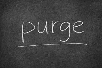 purge concept word on a blackboard background