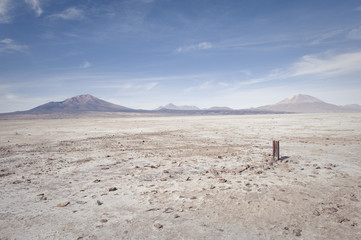 Rocky desert with mountain range in the distance