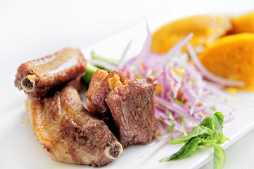 Traditional Peruvian Meal Called Chicharron de Panceta de Cerdo Served in a Restaurant.