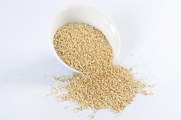 quinoa popping. On a white background. Cereal.
