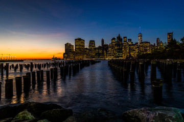 New York Skyline Cityscape Lower Manhatten World Trade Center Freedom Tower from Brooklyn Bridge Park Pier