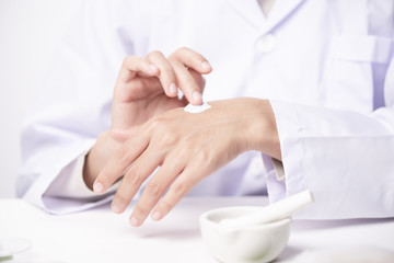 Obraz na płótnie Canvas doctor applying hand cream