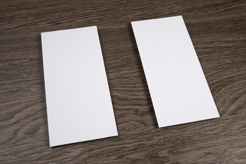 Blank flyer over wooden background to replace your design.