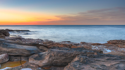 Fototapeta na wymiar Coastal Sunrise from the Rock Platform
