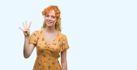 Young redhead woman showing and pointing up with fingers number four while smiling confident and happy.