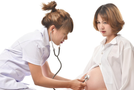 Portrait  of doctor Care about young pregnant woman on white background. This image for  healthcare concept. Doctor use strethoscope for check up pregnant.