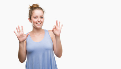 Fototapeta na wymiar Young blonde woman showing and pointing up with fingers number eight while smiling confident and happy.