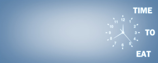 Clock with Time To Eat words on a blue background. Time To Eat Concept