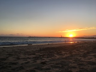 Sunset over the waves at Playa Del Rey Beach in Los Angeles California.