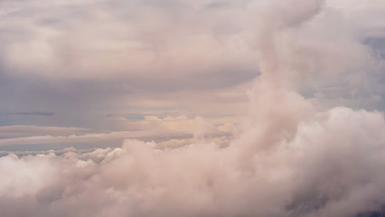 Naklejka na ściany i meble Soft clouds from the plane in the sky landscape