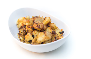 roasted potatoes in a white bowl