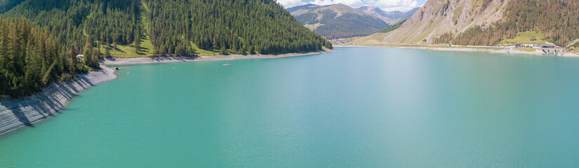 Drone aerial view of the Lake Livigno an alpine artificial lake. Italian Alps. Italy