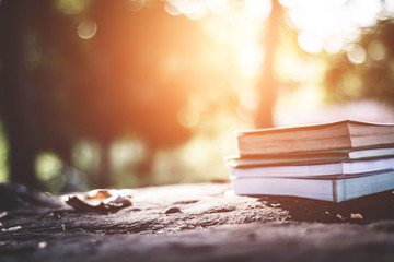 Close up books on the floor in nature.