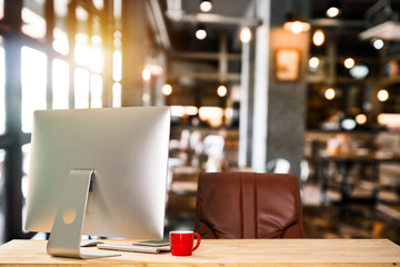 workspace with laptop, office supplies, and coffee cup at office. desk work concept. in morning light
