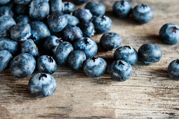 Blueberries on old wooden table.