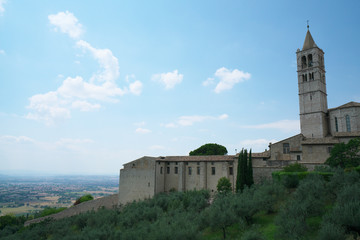 Fototapeta na wymiar Assisi,Italy-July 28, 2018: View of Basilica di Santa Chiara or Basilica of St. Clare from Borgo Aretino street, Assisi 
