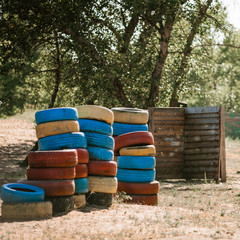 Special playground for military game with car tires and shelter