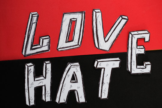 written word love  on a red background and hate on a black background