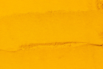 Close up of Turmeric powder texture background