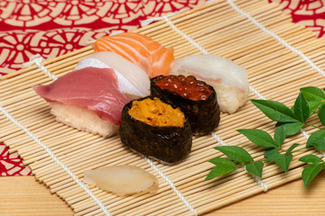 sushi set on white bamboo sheet