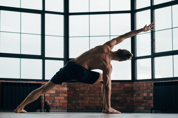 yoga for men. sport fitness and athletic lifestyle. strong body and toned muscles. man exercising...