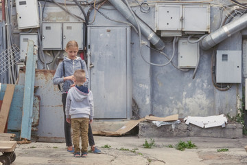 Obraz na płótnie Canvas Two children in the industrial site.