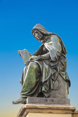 statue of Johannes Gutenberg,  in Frankfurt with the allegory of theology