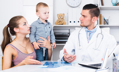 Fototapeta premium Adult male doctor leading medical appointment