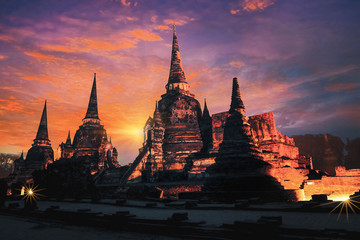 Fototapeta premium The ruins of the old temple in Ayutthaya historical park at sunset, Ayutthaya, Thailand