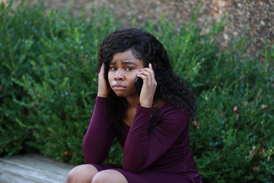 Crying Black Woman Speaking On Phone