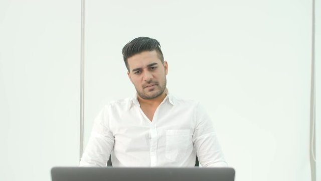 Business man getting very bad news on his laptop computer screen and feeling disappoint