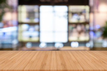 Perspective empty wooden table on top over blur background, can be used mock up for montage products display or design layout.