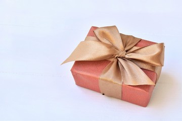 Gift box tied with a ribbon, left copy space. 