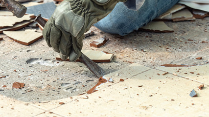 use chisel to remove the floor tile