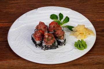 Roll with raw beef