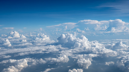 The sun shines through the big clouds