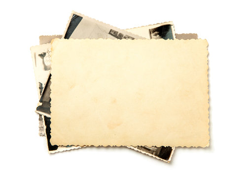 Stack old photos isolated on white background. Mock-up blank paper