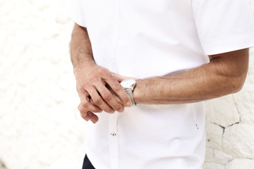 Wristwatch guy in white shirt, side view