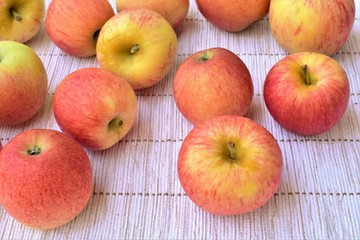 Naklejka na ściany i meble Ripe apples on a table, autumn garden harvest.
