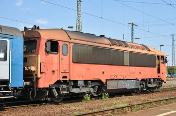 Fototapeta na wymiar Engine and railway carriage at the station