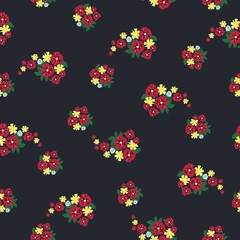 Seamless folk pattern with small cute flowers on a dark background. Shabby chic. Country Millefleurs liberty style. Rich floral texture.