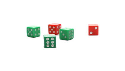 Red and green gambling dice isolated on white background