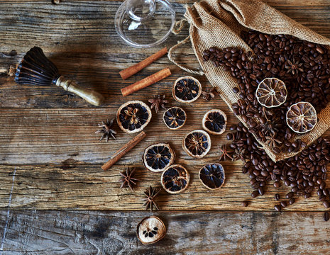 Spices, coffee beans and accessories for coffee making on the wooden table. Top view.